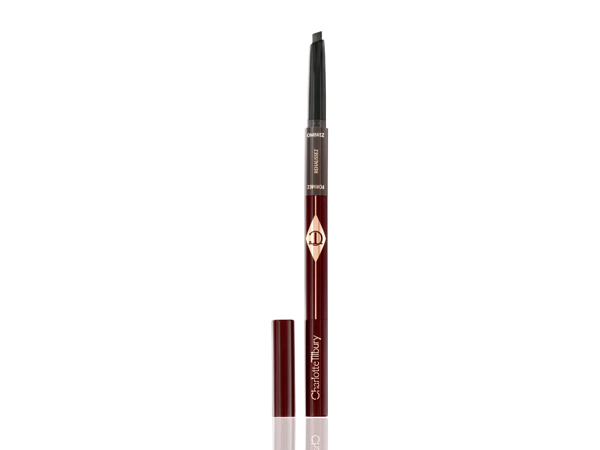 An open eyebrow pencil to fill, add shape and structure to eyebrows in dark crimson and gold-coloured packaging. 